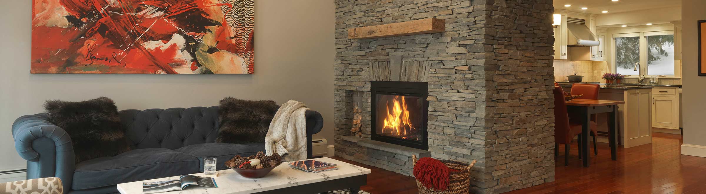 living room with stone fireplace