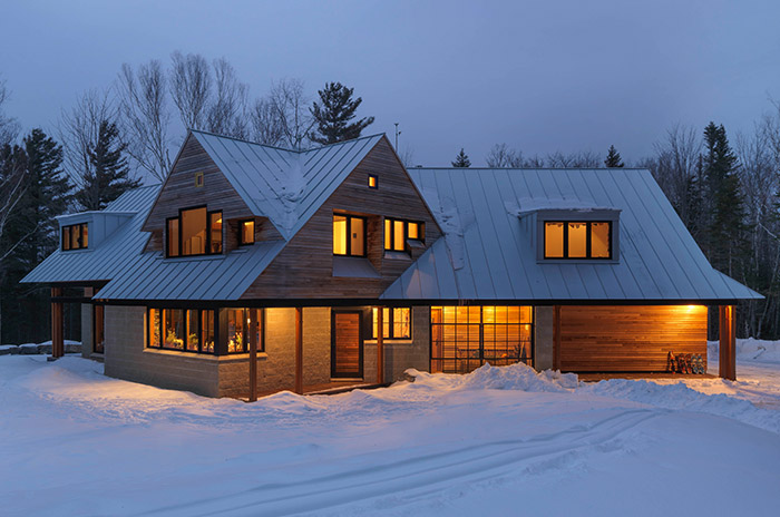 wooden modern home in the winter