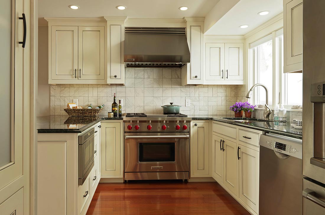 white country style kitchen with gas range
