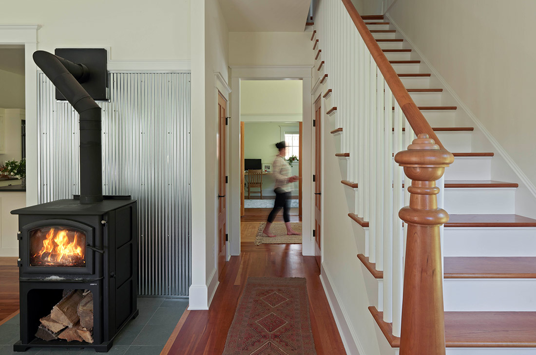 picture of staircase and small woodstove