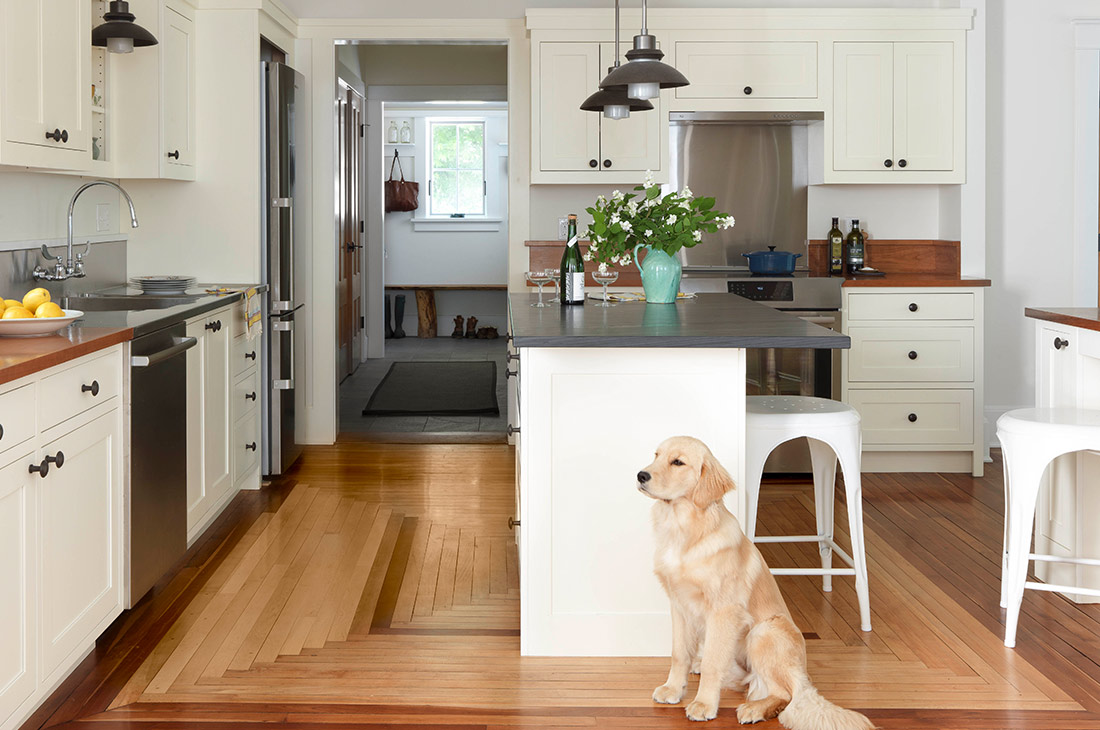 picture of the large kitchen and hardwood floors and stainless steel appliances