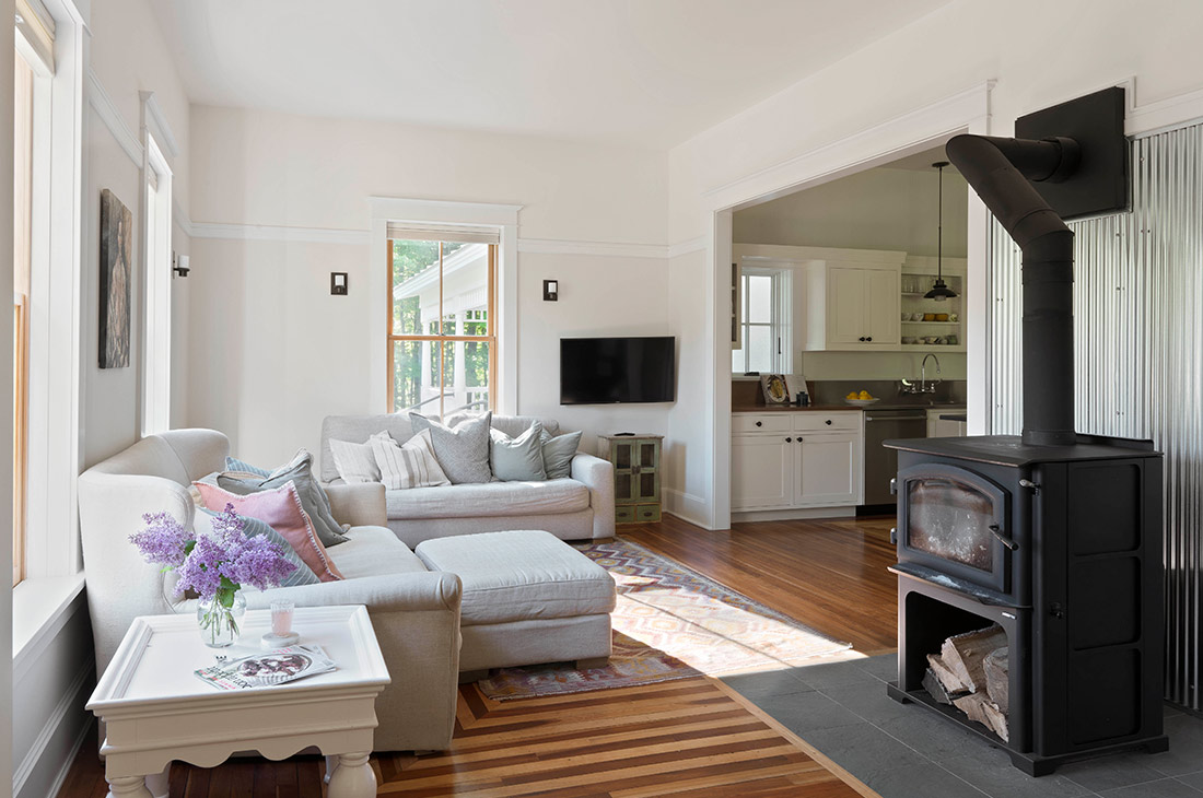 picture of living room and woodstove with natural light