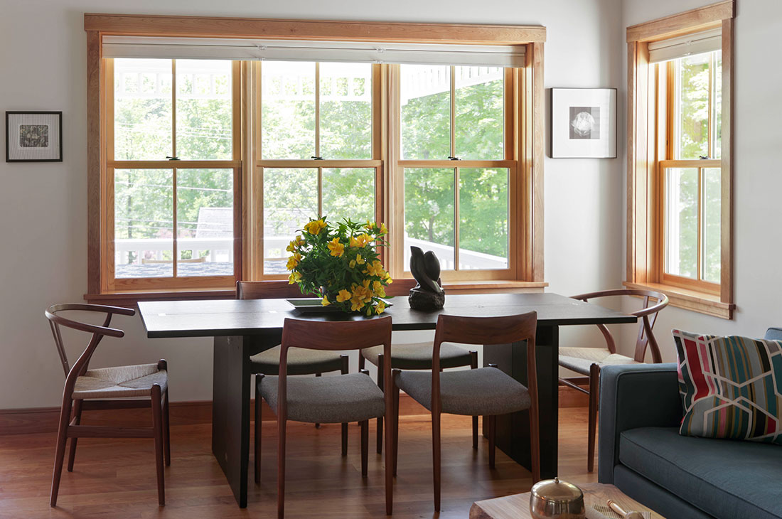 picture of the small dining room with dark wooden chairs