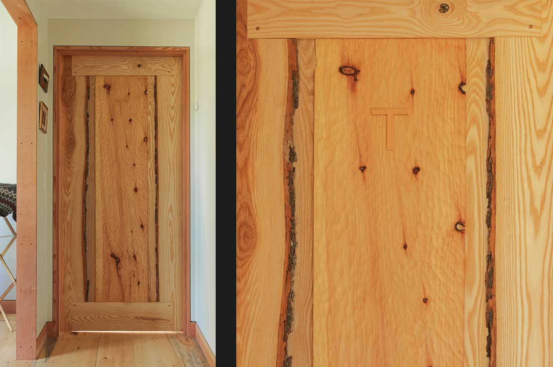 interior of the home with custom wooden door