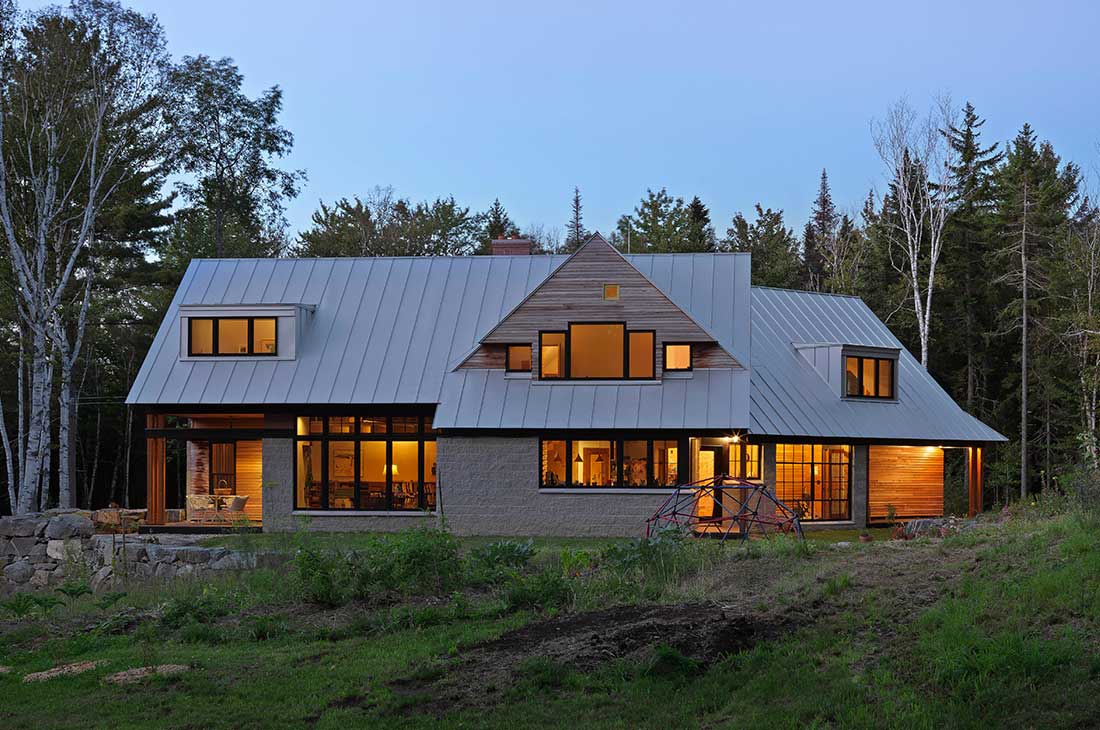 picture of the exterior of the home large windows on first and second floor