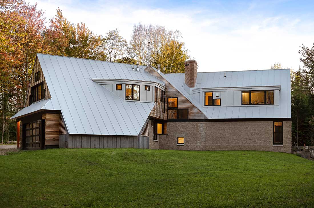 exterior of the home with large angular roof