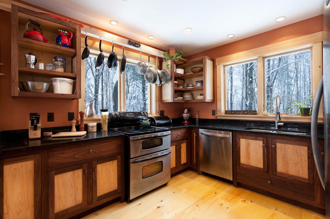 the kitchen with large windows and open shelves