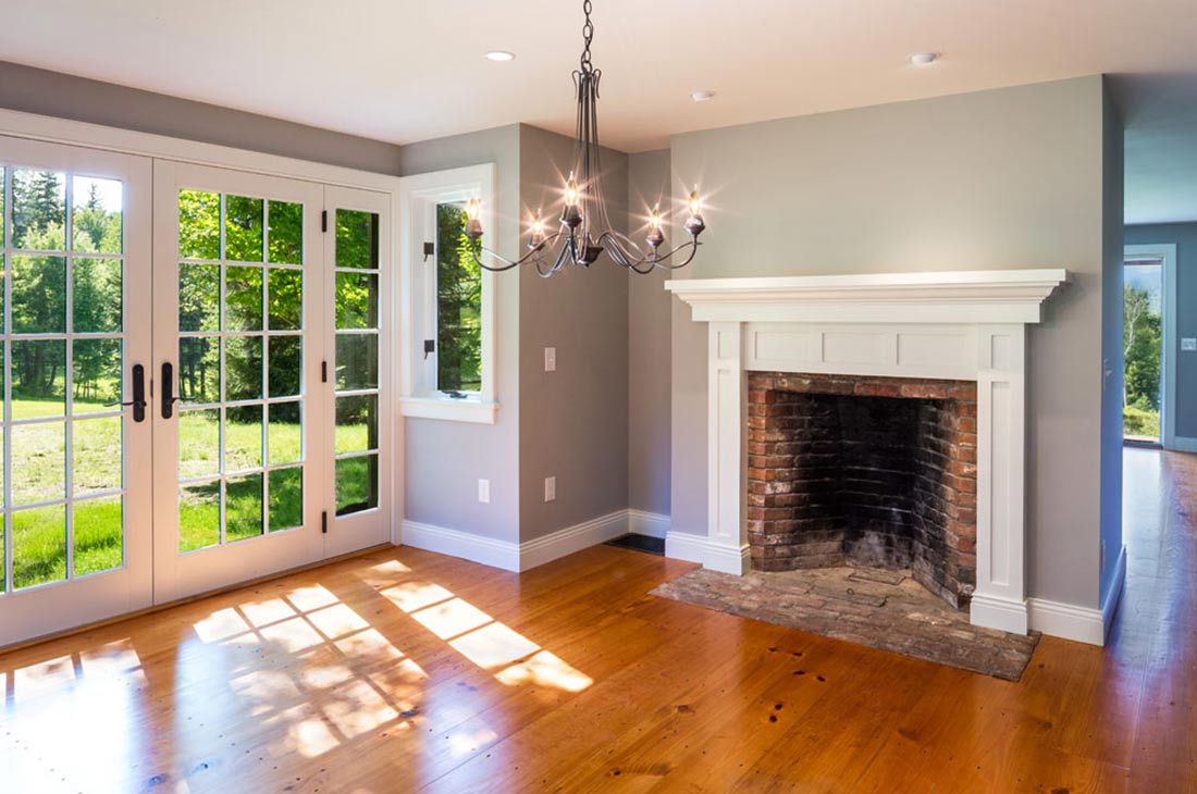 room with fireplace and french doors