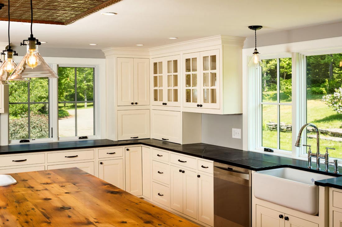 white kitchen with large wooden island