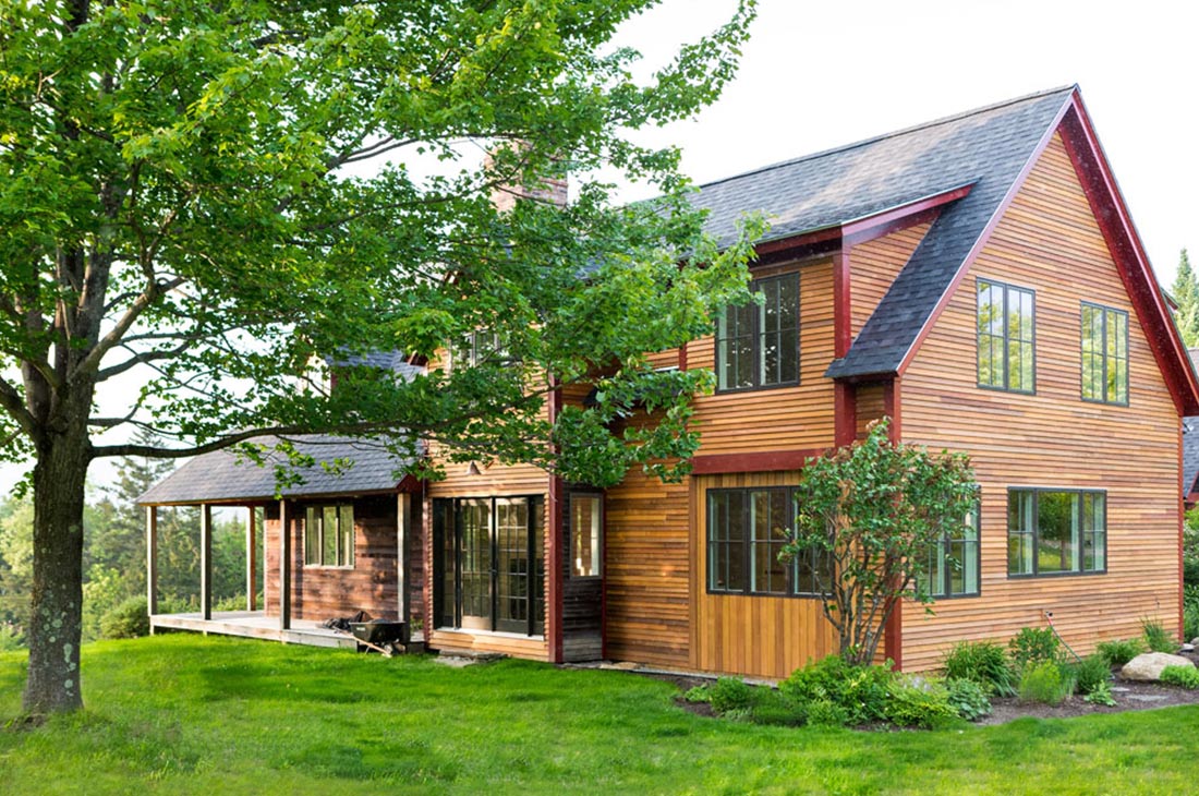 back of the home with large tree