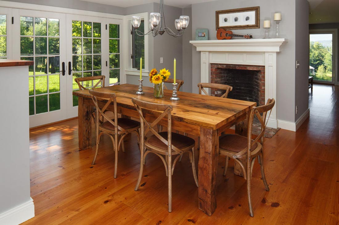 dining room with fireplace and wooden dining set