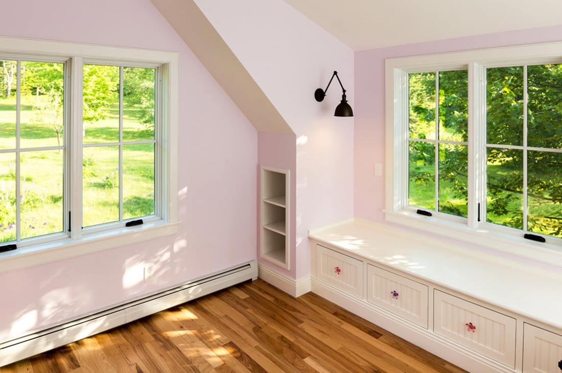 pink bedroom with built in bench seat