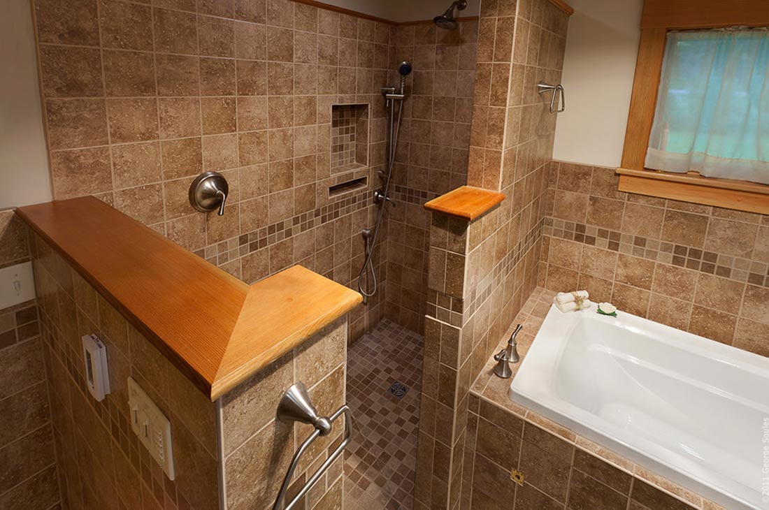 master bathroom with large shower and bathtub