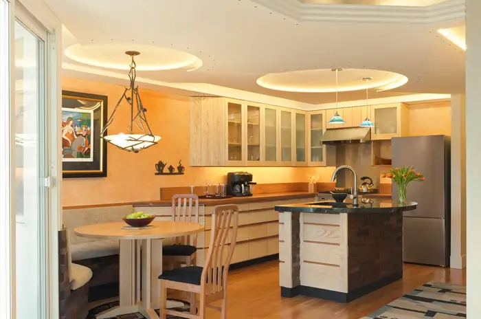 bright kitchen and booth dining area