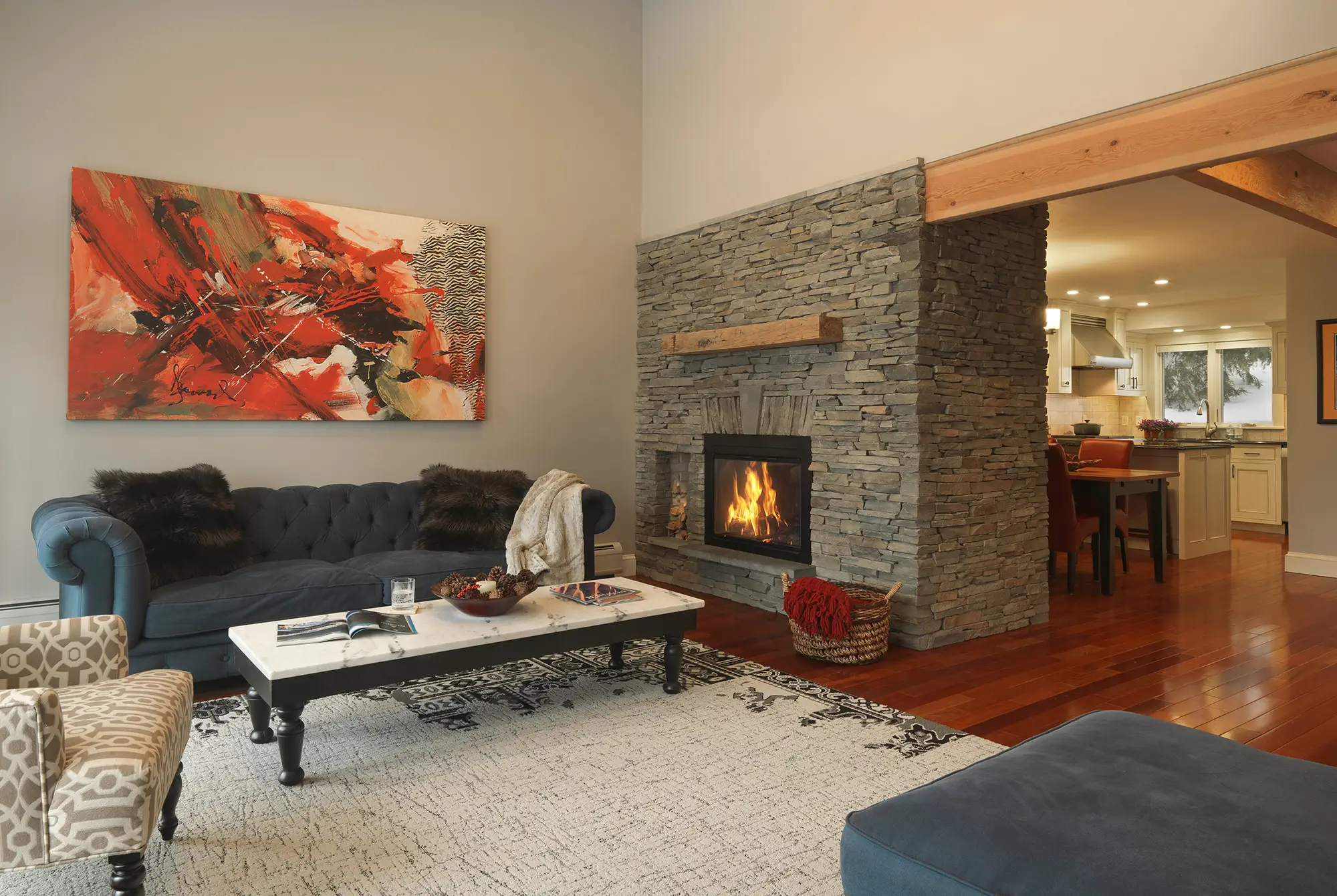 inside the condo living room with large fireplace