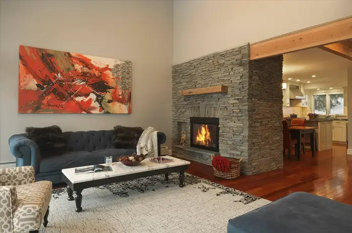 comfortable living room with stone fireplace
